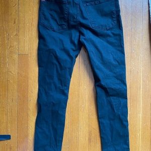 High rise black knee ripped skinny jeans.